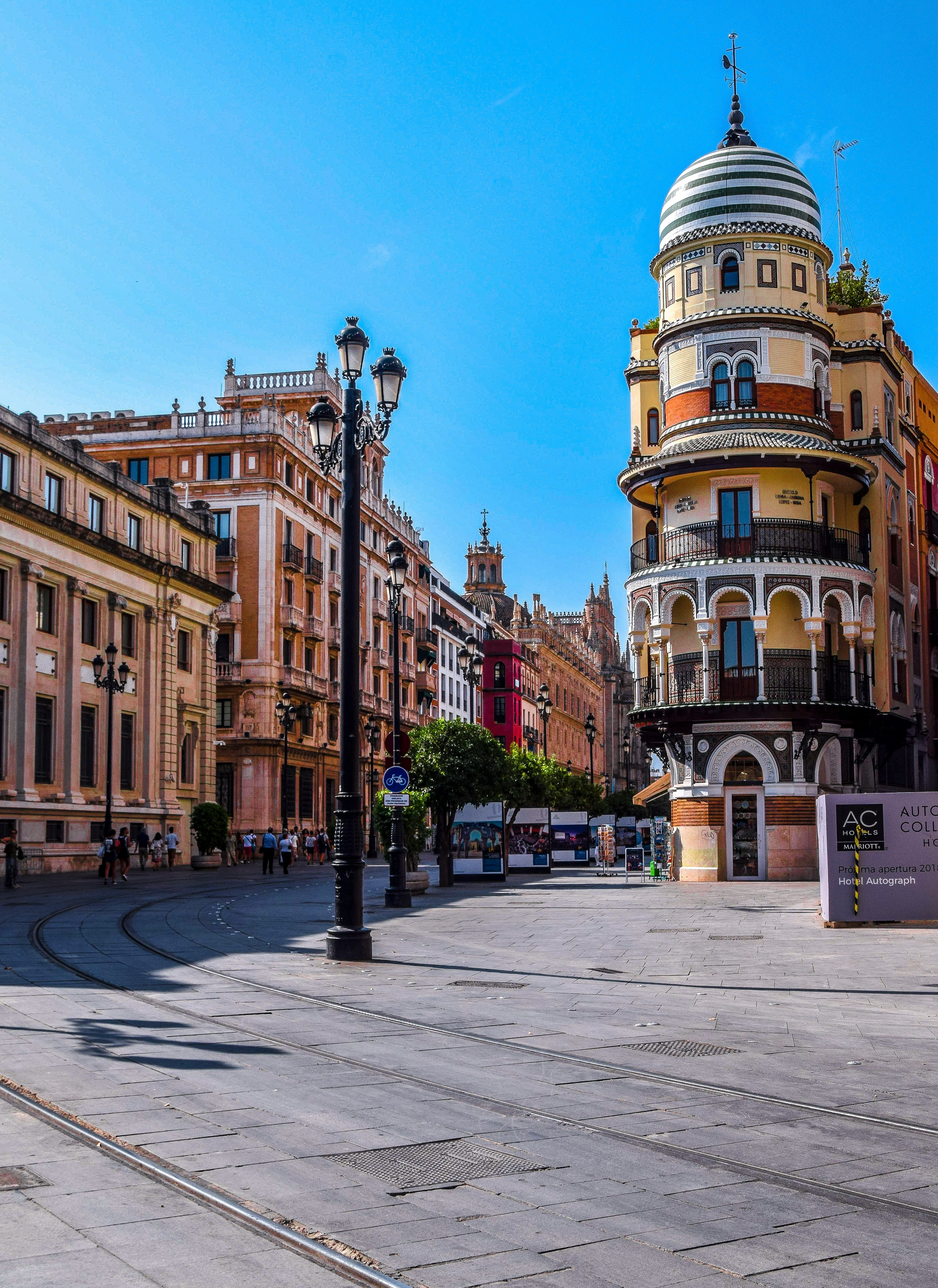 Sunlit Spanish street with relaxed city atmosphere